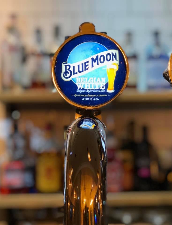 blue moon beer tap at the strathaven bar in strathaven